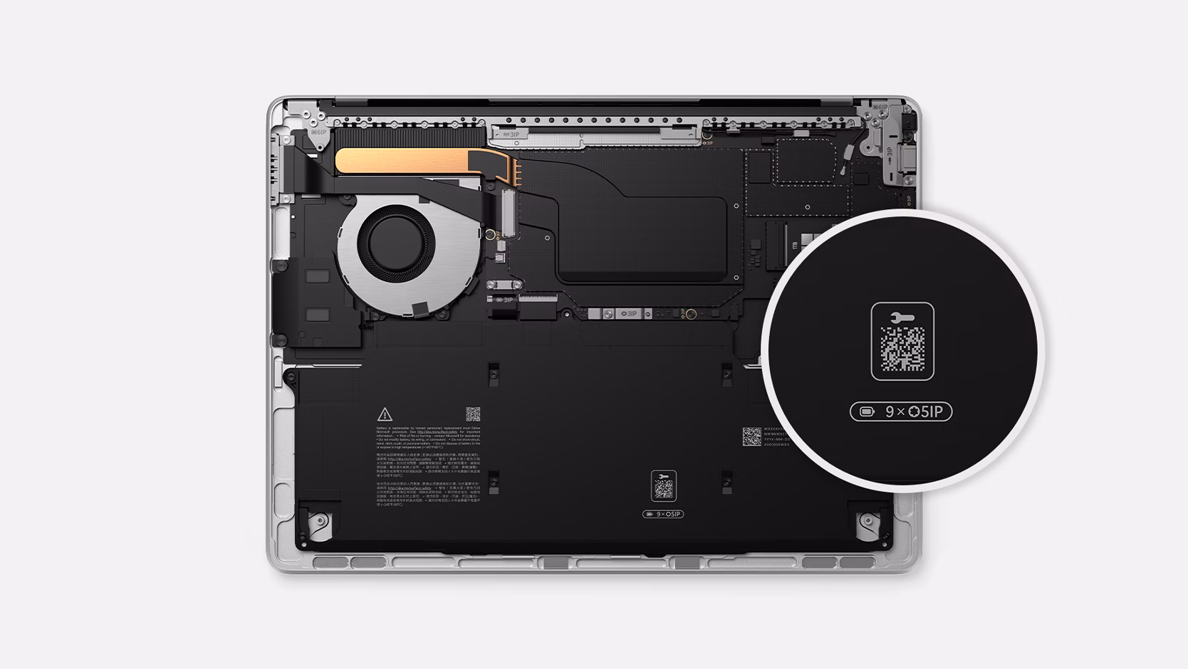 A Surface Laptop for Business with a close-up view of the QR code that pulls up repair instructions.
