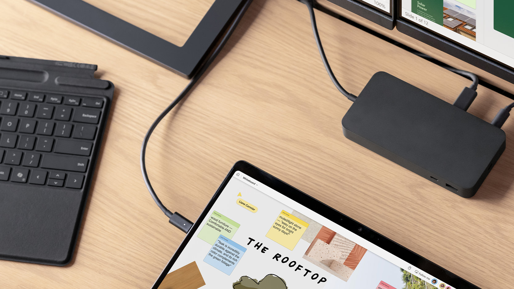 A Surface Pro 10 for Business and a Surface Thunderbolt 4 Dock connected by cables, demonstrating their connective abilities.