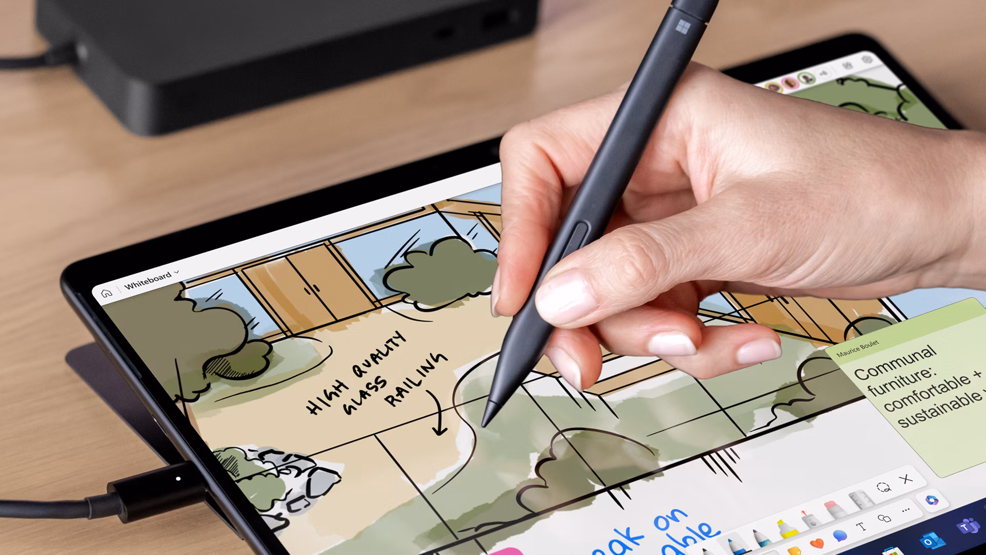 A close-up of a person using a Slim Pen to draw on the touchscreen of a Surface Pro.
