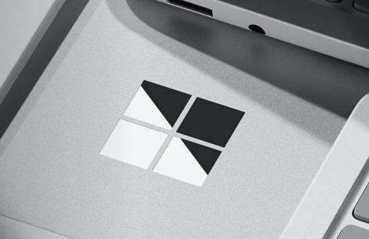A close-up of the Microsoft logo on a Surface device.