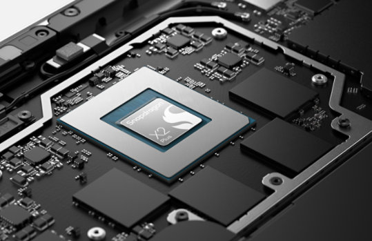 A close-up of a Snapdragon® X2 Plus chip on the motherboard of a Surface Pro for Business.