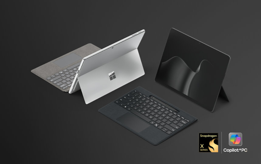 A Surface Pro for Business in the colour Platinum and a Surface Pro for Business in the colour Black, Copilot+ PCs with Snapdragon® processors, paired with the Surface Pro 13-inch Flex Keyboard for Business.