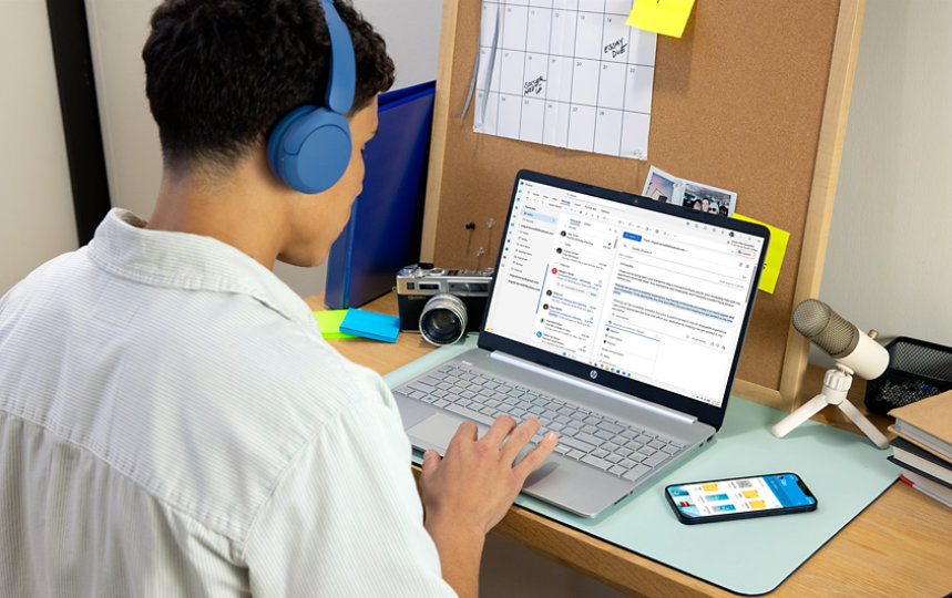 A student uses Outlook on his laptop. 